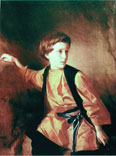 Portrait of a boy in an orange shirt