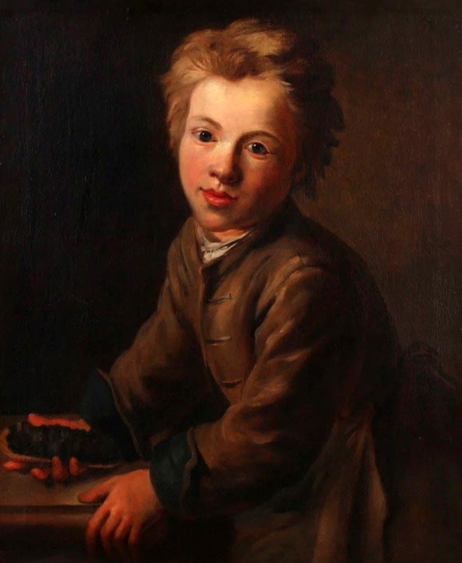 A young boy holding a tartine (Мальчик, держащий тартинку)