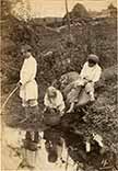 Peasant children on the river bank