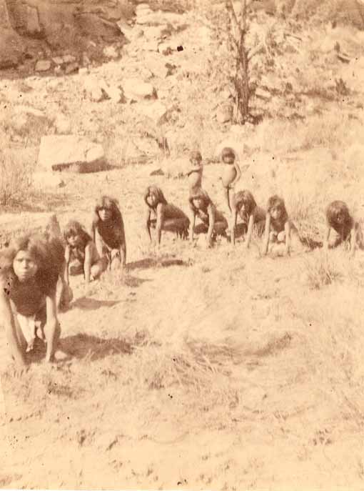 Group of children crouching on the ground while playing a game of 'wolf and deer' (Группа присевших детей, играющая в игру «Волк и олень»), 1872