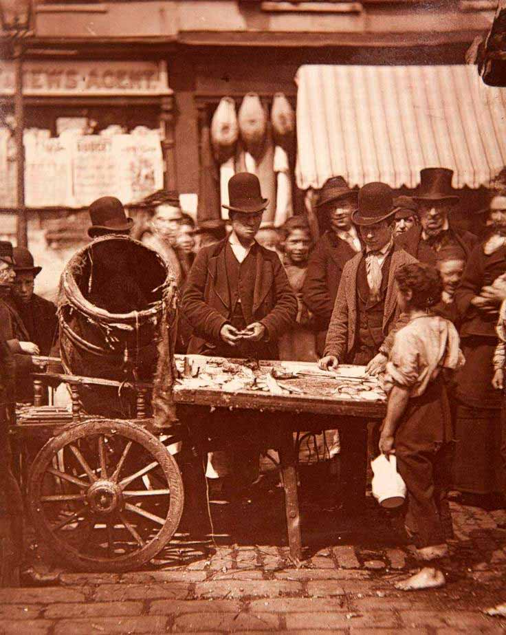 Barefoot boy trembles on the cold cobble's begging for a few smoked herrings, 1870s