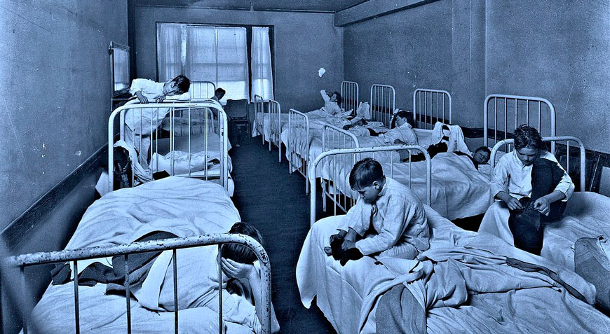 6 AM showing boys waking up in the morning in a ward sleeping room at the Boys Hotel (6 утра - подъём мальчиков в спальне Отеля для мальчиков)