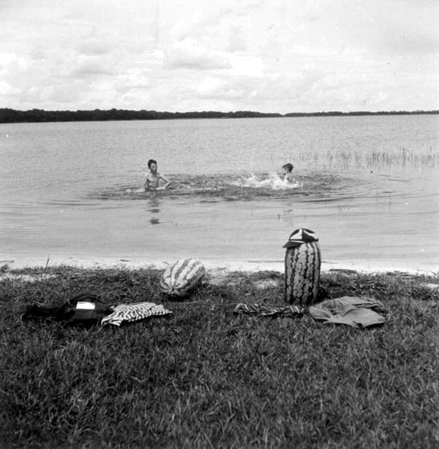 Johnny Suggs and Rogers Goolsby taking a dip with their watermelons (Джонни Саггс и Роджерс Гулсби купаются со своими арбузами)