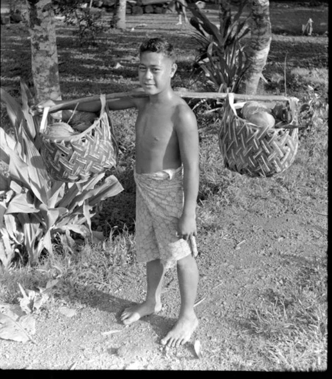 Unidentified boy carrying items in woven baskets (Неопознанный мальчик, несущий вещи в плетеных корзинах), Oct.1952