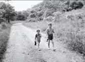 Two young boys head home after fishing / Два мальчика, идущие домой после рыбалки