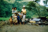 Family standing by remains of house / Семья стоит у руин дома