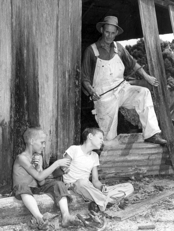 Two boys get caught by their father while testing leaf tobacco (Двое мальчиков пойманы их отцом за курением табака), 1948