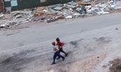 Дети среди разрушенных во время боев зданий / Children among buildings destroyed during fighting