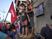 Boys stand atop a barrel during a rally / Мальчики стоят на бочке на митинге