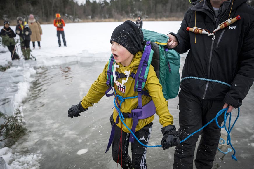 A 5th grade student from Vaxmora School participates in an exercise teaching them how to react when falling into hole in the ice (Ученик 5-го класса школы Ваксмора участвует в упражнении, обучающем их действиям при падении в прорубь во льду), 2023