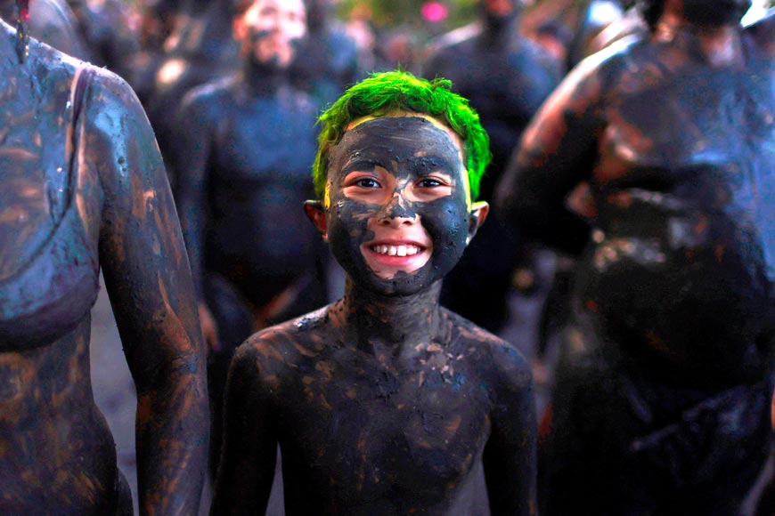 A boy attends the 'Bloco da Lama' (Block of Mud) group during the carnival festivities (Мальчик из группы «Блоко да Лама» во время карнавала), 11 February 2024