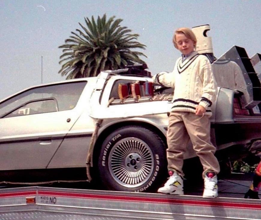 Macaulay Culkin (10) rocking Reebok Pump Twilight Zones while leaning on a DeLorean (Маколей Калкин (10) в кроссовках Reebok опирается на DeLorean), 1990