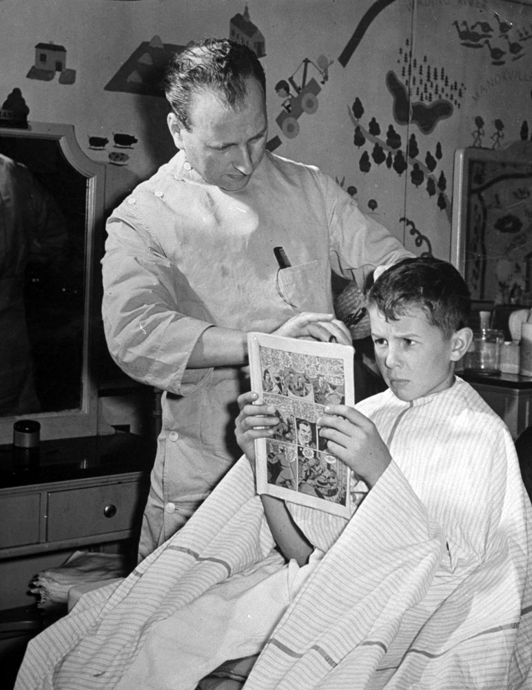 12-year-old boy sitting in a barber chair (12-ти летний мальчик, сидящий в кресле парикмахера), 1942