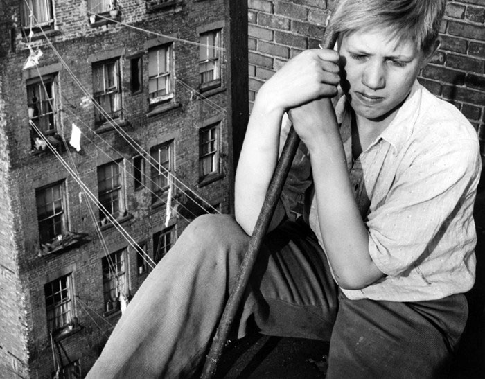 A boy sits on a rooftop (Мальчик, сидящий на крыше), 1940s