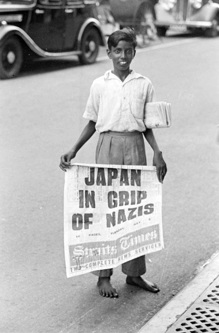 Newspaper boy holding Straits Times newspaper (Продавец газет), c.1941