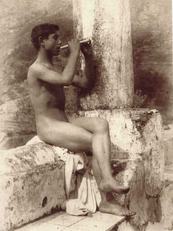 #2570, Boy playing a flute, at the Mount Ziretto vineyard, 1900s