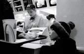 A homeless boy begs for alms
