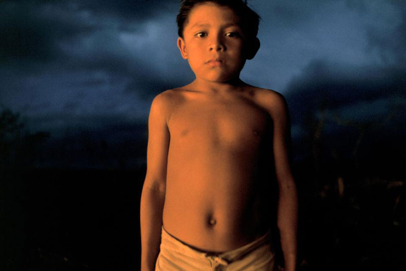 A young boy glows in the firelight (Мальчик в cвете от костра). Tiziman, Mexico, 1975