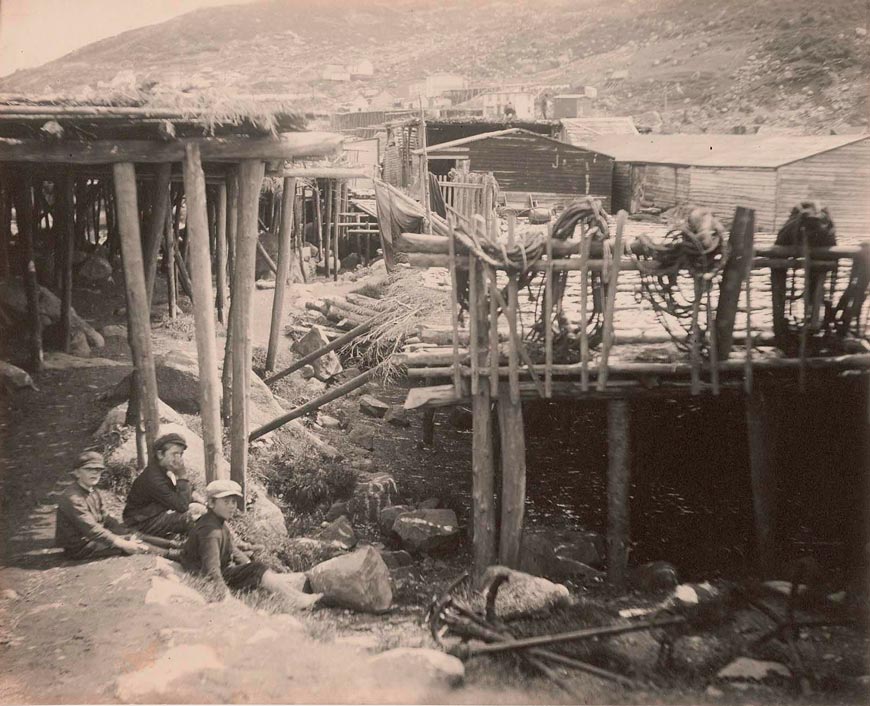 Boys sitting under dock platforms (Мальчики сидят под платформами причалов), c.1912