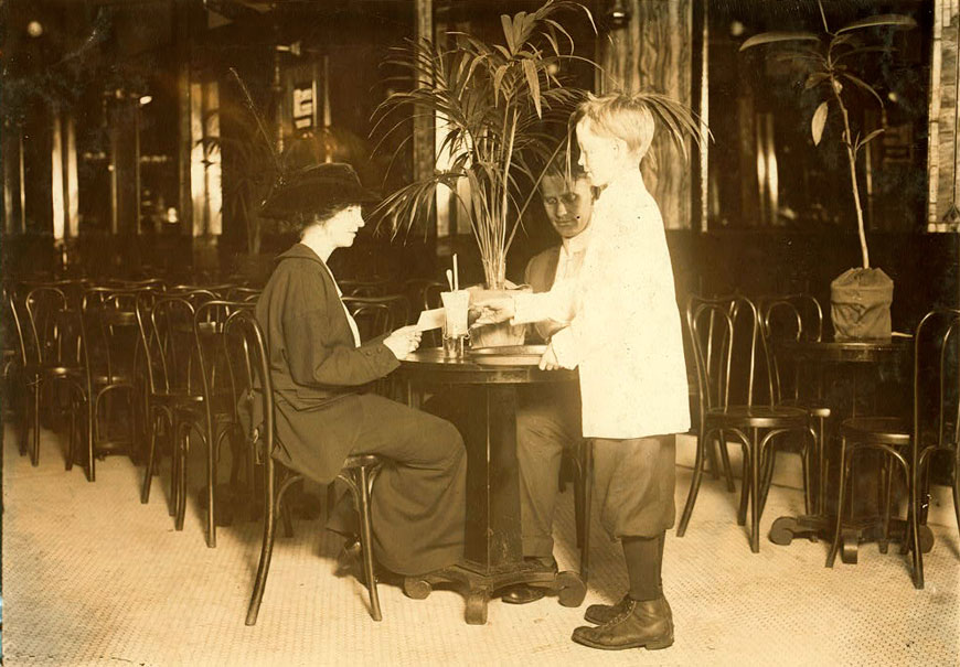 A young table boy in Newsome's ice cream parlor (Юный официант в зале кафе-мороженое Ньюсома), October 1914