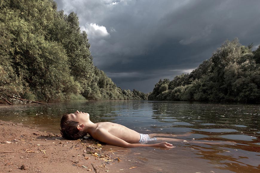 Egor, a boy from the Porkhov orphanage is bathing on a wild beach in the village of Fedkovo (Егор, мальчик из Порховского детского дома, купается на диком пляже в селе Федьково), 2011