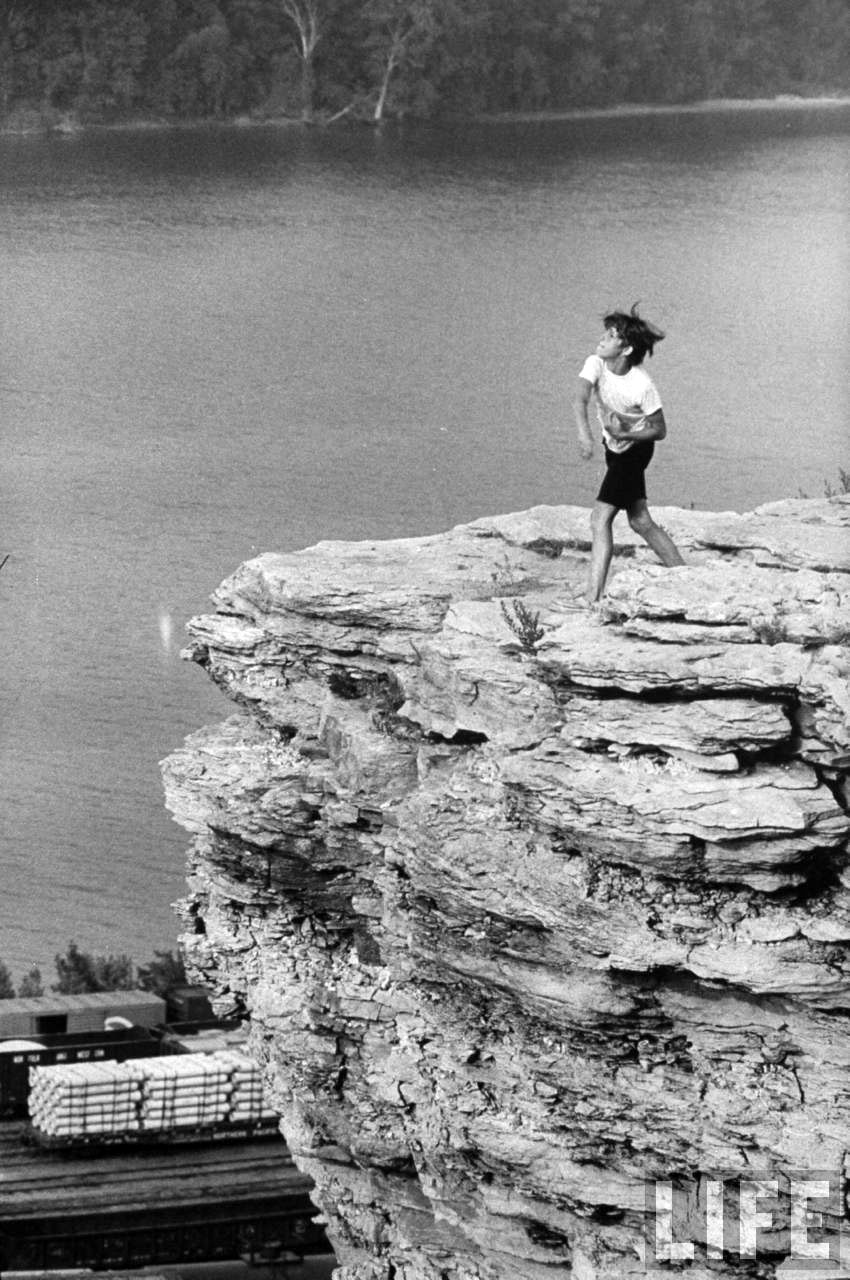 Patrick Powell throwing rocks at passing train, 1970 