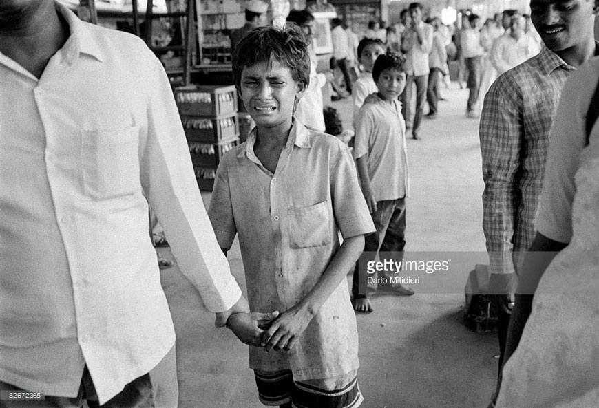 Street child Mijanoor, a 12 year old boy from Calcutta, is arrested at Dadar railway station during a round-up by police