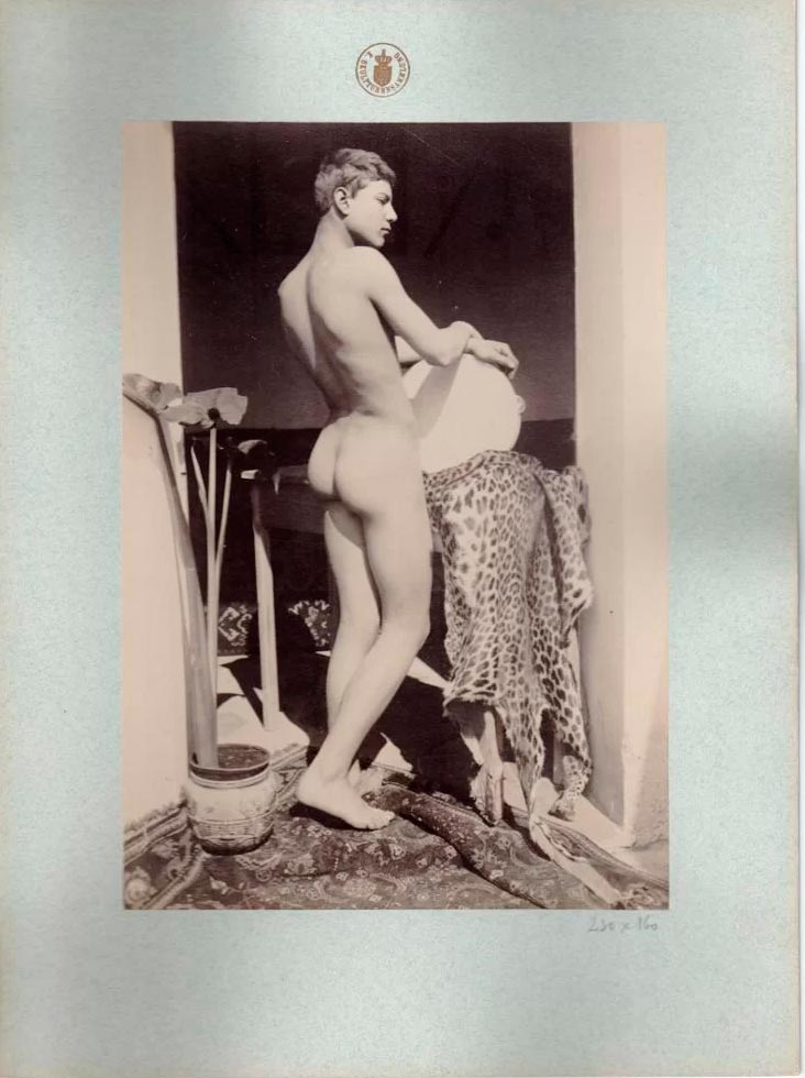 A boy at a table with a leopard skin (Мальчик за столом с леопардовой шкурой), 1880-1910