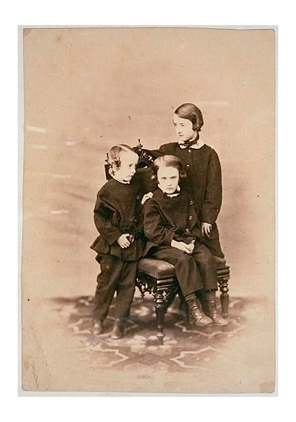 Two boys and a young girl by a carved chair (Два мальчика и девочка на резном стуле), 1860s