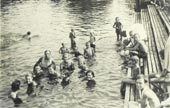 Vacationers swim in the Ucha River