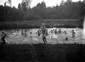 Pioneers swimming in the river