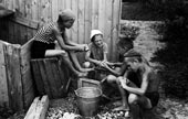 At the summer camp, peeling potatoes