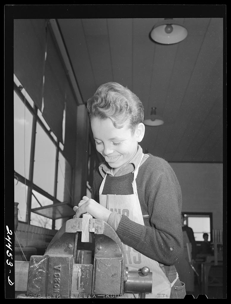 Boy in shop class. Homestead school (Мальчик в мастерской. Фермерская школа), December 1941