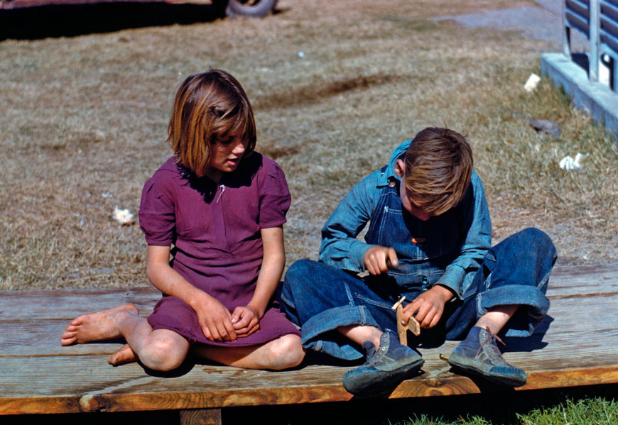 Boy building a model airplane as girl watches (Мальчик, строящий модель самолёта, и девочка, наблюдающая за ним), Jan.1942