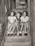 Children of citrus workers in hallway of apartment house, Jan.1937