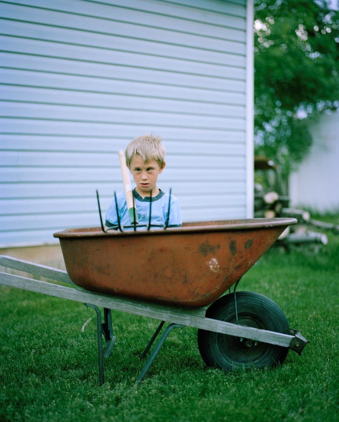 My nephew Pratt plays with a pitchfork and wheel barrel, used for the family’s small garden (Мой племянник Пратт играет с вилами и тачкой, которые используются в маленьком семейном саду), June 2011