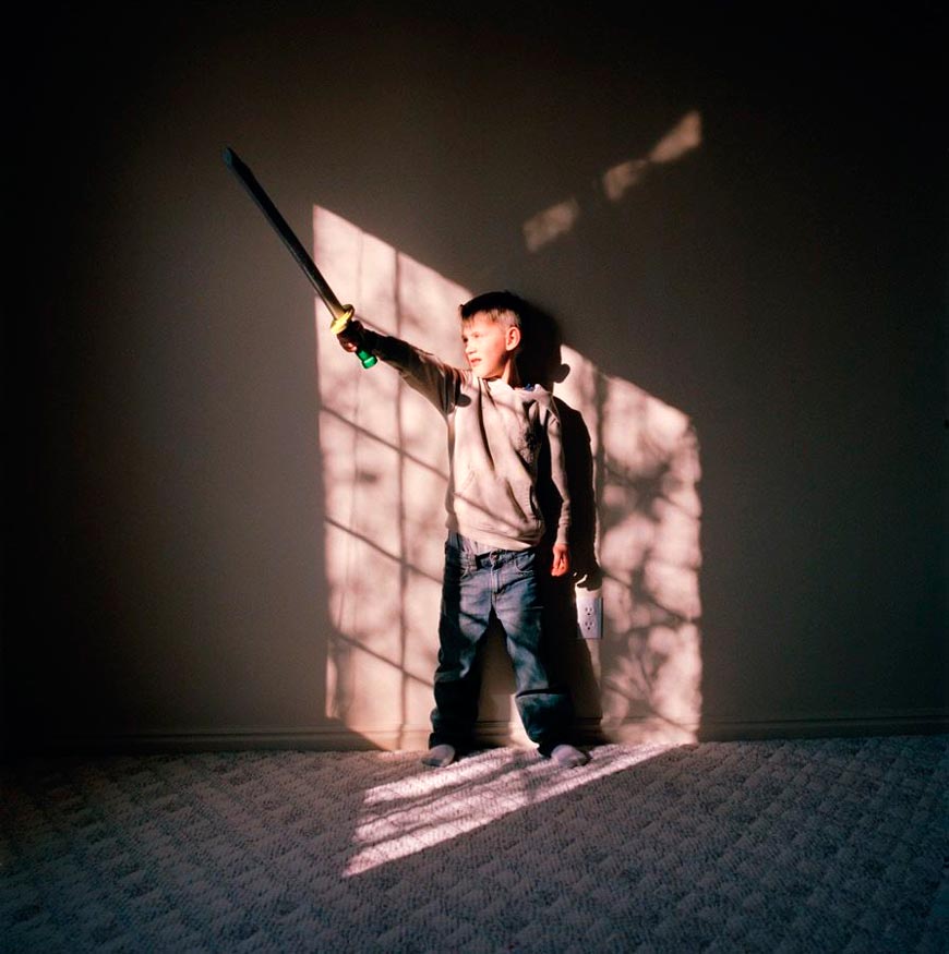 My nephew Pratt raises a toy sword toward the window light in his bedroom (Мой племянник Пратт поднимает игрушечный меч к свету в окне своей спальни), November 2009