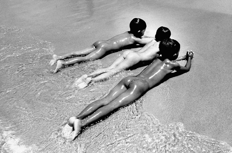 Three Native Boys Sunbathing Nude at the Edge of the Surf at Ocean Beach, Malaysia (Три мальчика загорают голышом на Океанском побережье, Малайзия), Dec.1951