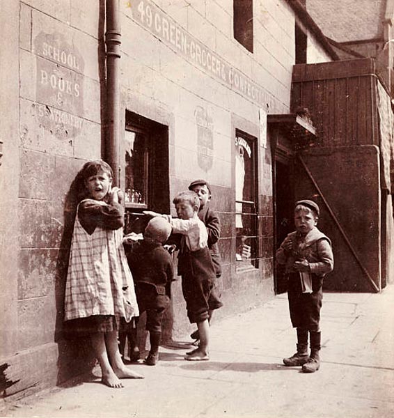 A group of children outside a greengrocer's shop (Группа детей у овощного магазина), c.1905