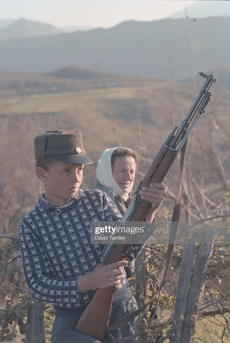 Boy Holding a Rifle (Мальчик с ружьём), 1997