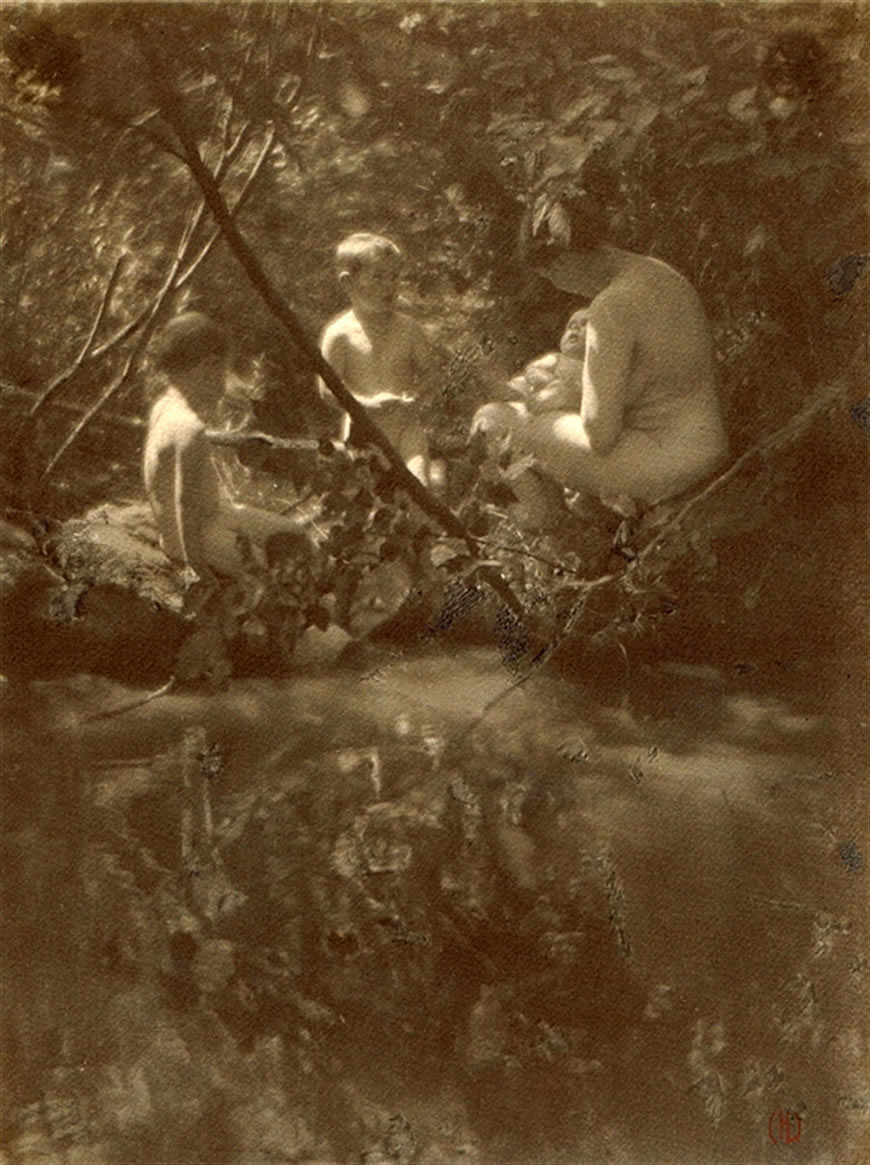 Mrs. Willard Helburn with baby and two sons nude in a forest, 1919 