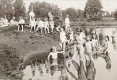 Village children bathing in the pond