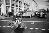 A boy on a bicycle crosses Gorky Street